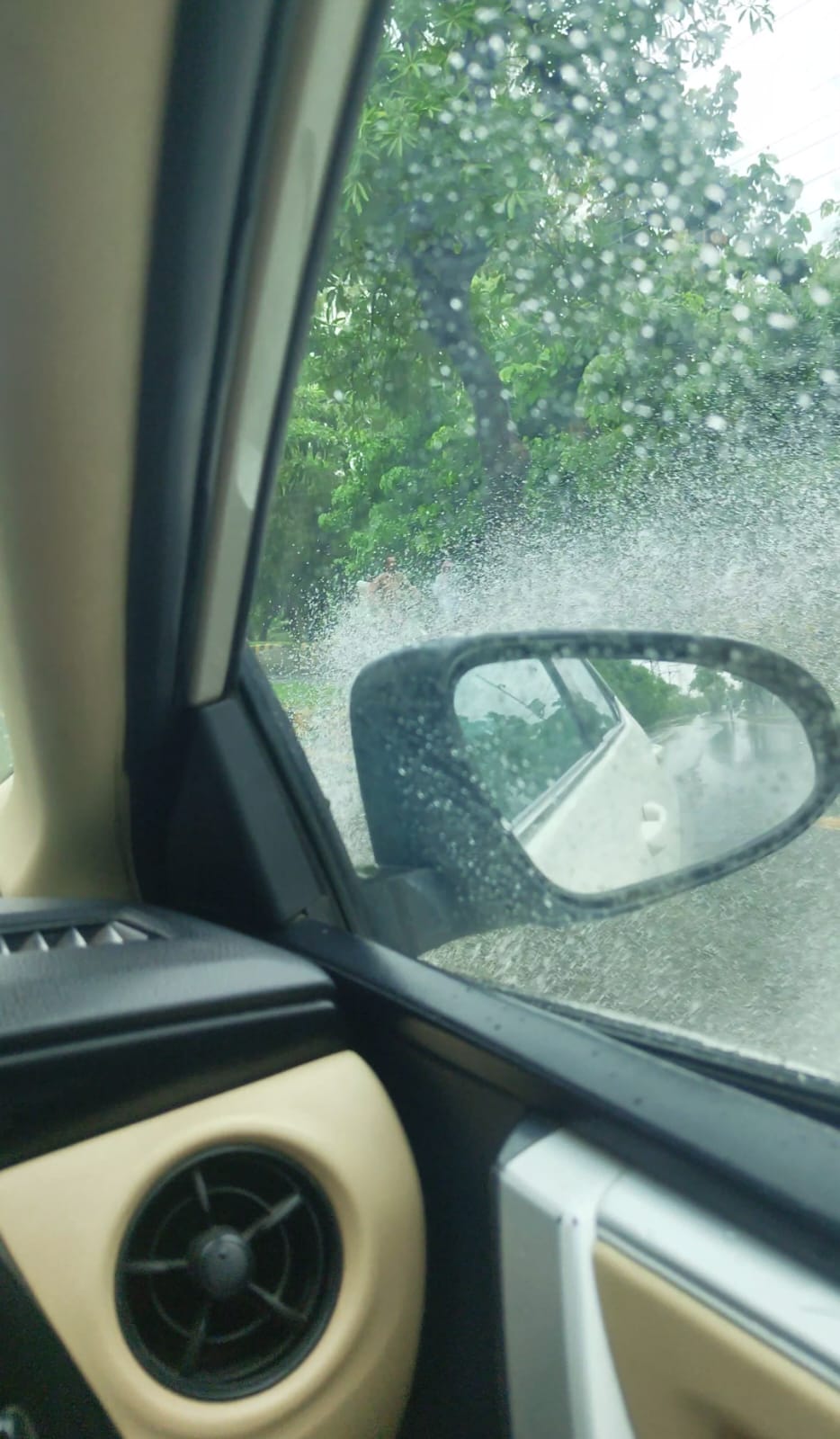 Rain on the car window — on the road