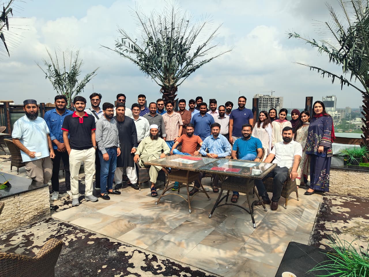 Rooftop group photo with the whole team